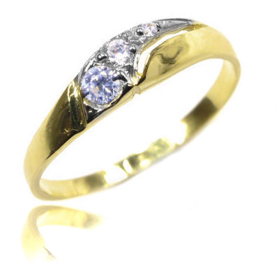 Golden ring with zircons