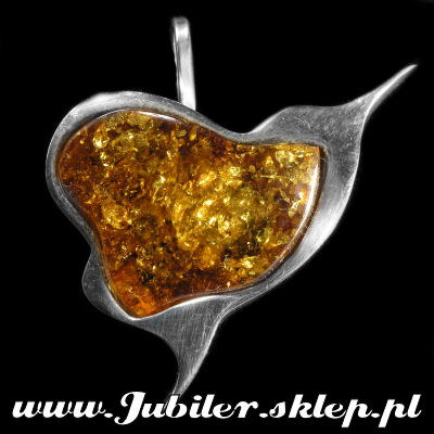 Silver brooch with  an amber